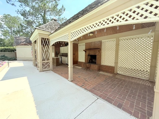 302 W 26th St, Tifton, GA 31794 - view of patio with an outdoor brick fireplace