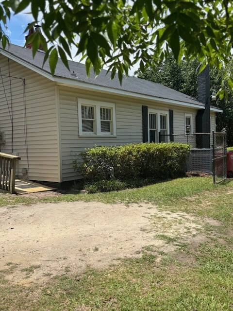 407 N Ridge Ave, Tifton, GA 31794 - view of property exterior featuring a chimney