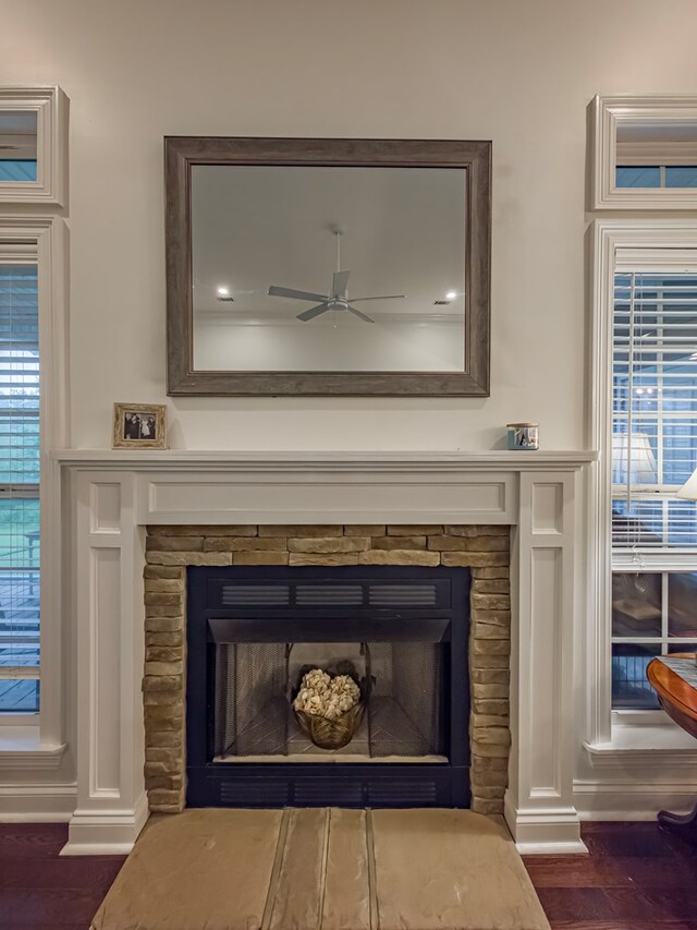 74 Surrey Cir, Tifton, GA 31793 - detailed view of a stone fireplace, a ceiling fan, and wood finished floors