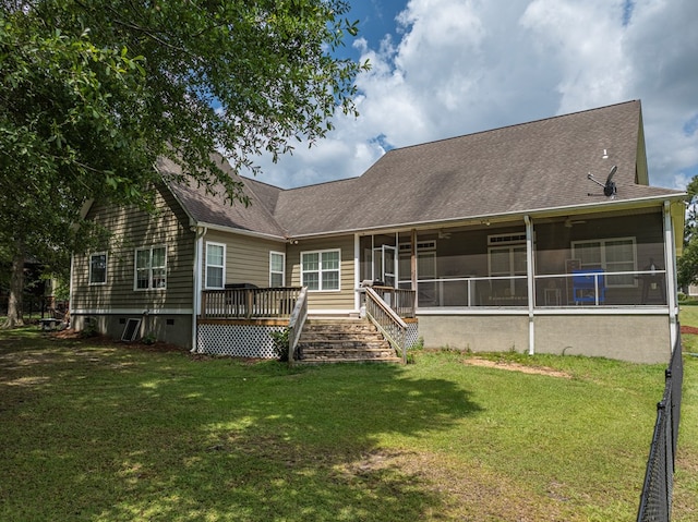 74 Surrey Cir, Tifton, GA 31793 - back of property featuring a sunroom, a shingled roof, a lawn, and a deck