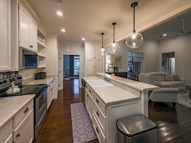 74 Surrey Cir, Tifton, GA 31793 - kitchen with appliances with stainless steel finishes, ornamental molding, light countertops, dark wood-type flooring, and white cabinetry