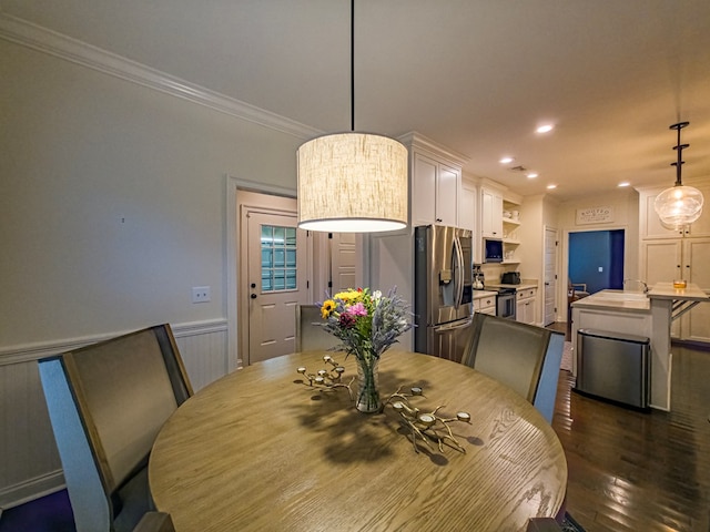74 Surrey Cir, Tifton, GA 31793 - dining room with ornamental molding, dark wood finished floors, recessed lighting, and wainscoting