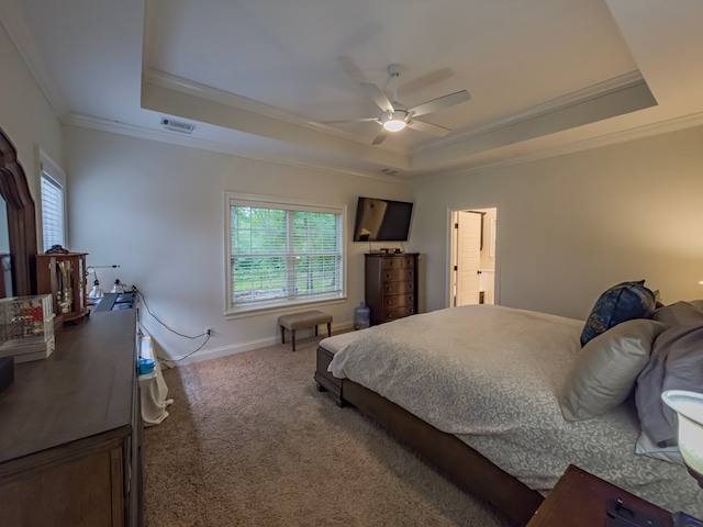 74 Surrey Cir, Tifton, GA 31793 - bedroom with a raised ceiling, crown molding, multiple windows, carpet, and a ceiling fan
