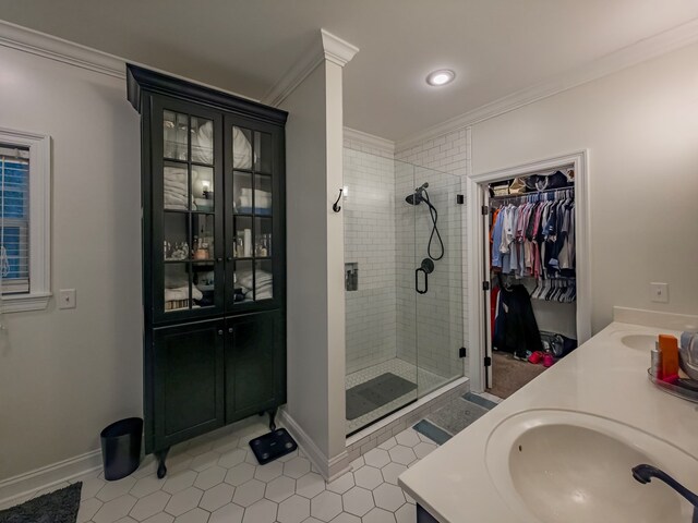 74 Surrey Cir, Tifton, GA 31793 - full bathroom with crown molding, a stall shower, tile patterned floors, double vanity, and a spacious closet