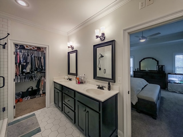 74 Surrey Cir, Tifton, GA 31793 - ensuite bathroom featuring double vanity, ornamental molding, a shower, ceiling fan, and a spacious closet