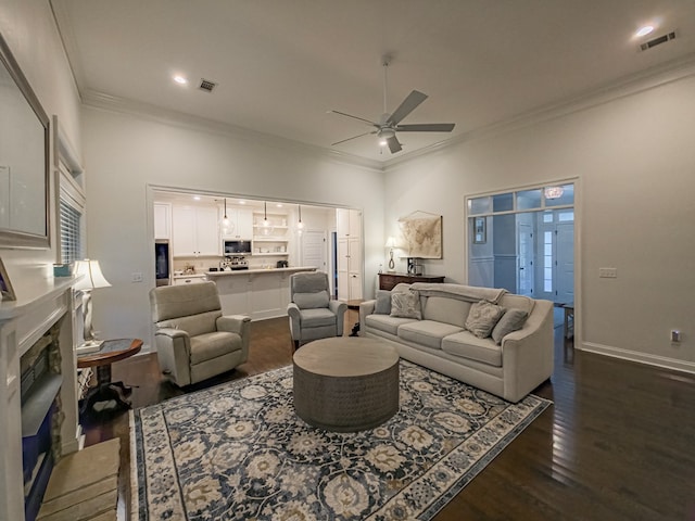 74 Surrey Cir, Tifton, GA 31793 - living room featuring ornamental molding, a ceiling fan, dark wood-type flooring, a fireplace, and recessed lighting