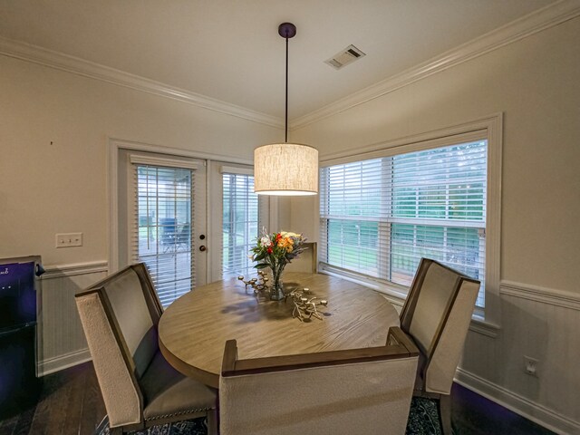 74 Surrey Cir, Tifton, GA 31793 - dining space featuring ornamental molding, wainscoting, dark wood finished floors, and a decorative wall