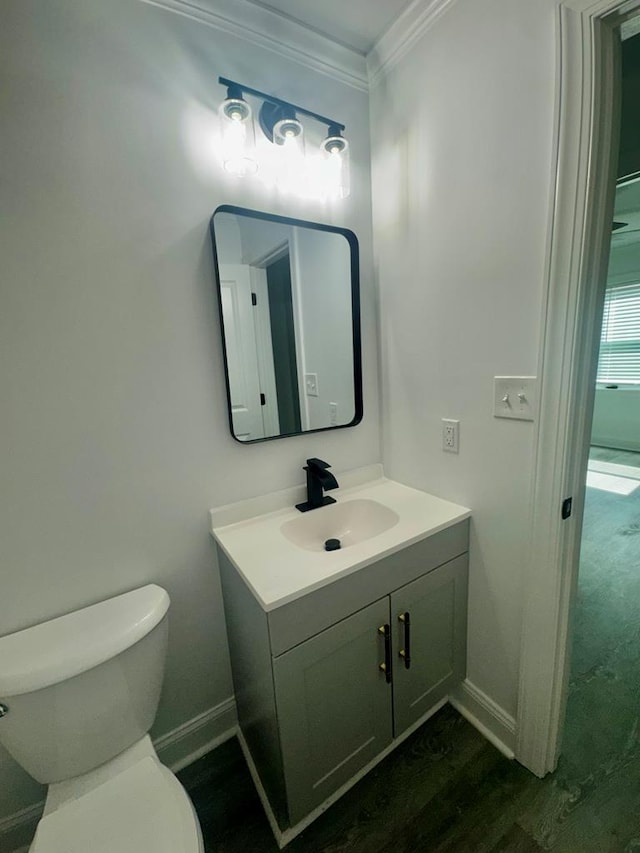702 N Livingston St, Sylvester, GA 31791 - half bath with vanity, ornamental molding, and wood finished floors