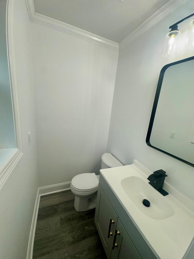 702 N Livingston St, Sylvester, GA 31791 - bathroom with wood finished floors, crown molding, and vanity