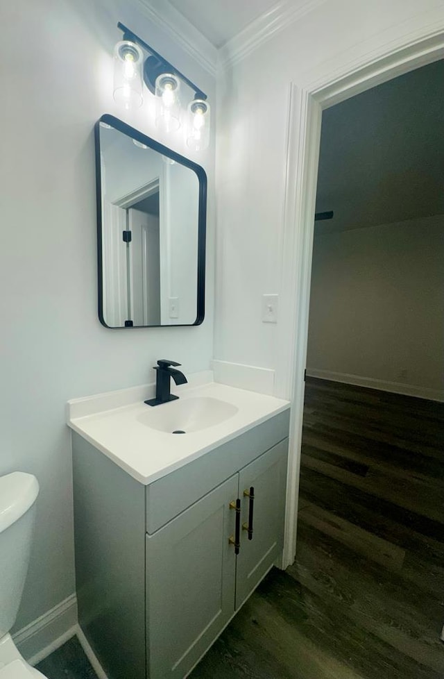 702 N Livingston St, Sylvester, GA 31791 - half bath with vanity, crown molding, and wood finished floors