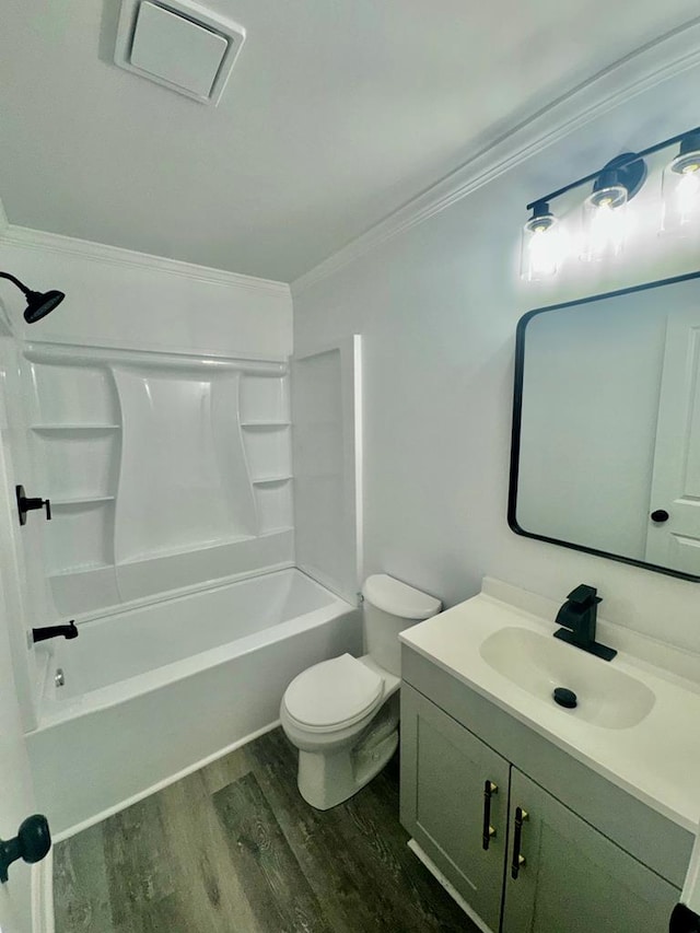 702 N Livingston St, Sylvester, GA 31791 - full bath with wood finished floors, vanity, crown molding, and washtub / shower combination