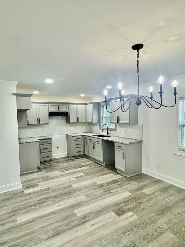702 N Livingston St, Sylvester, GA 31791 - kitchen featuring gray cabinets, light wood-type flooring, tasteful backsplash, and recessed lighting