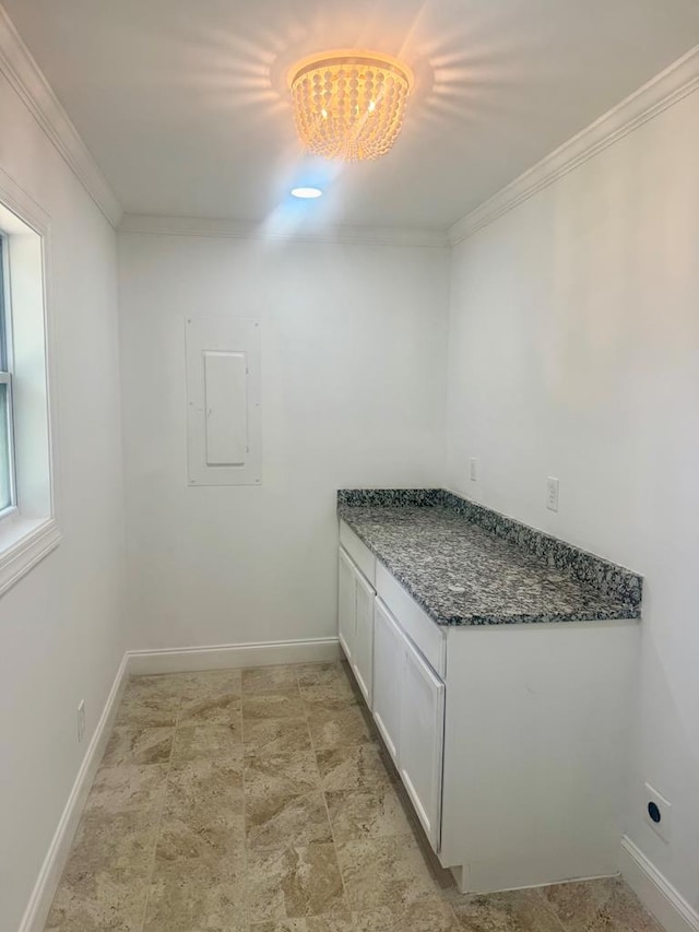 702 N Livingston St, Sylvester, GA 31791 - washroom featuring crown molding, a chandelier, electric panel, and electric dryer hookup