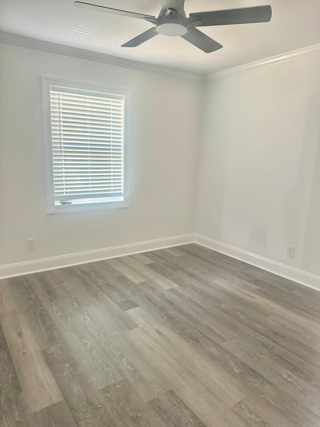 702 N Livingston St, Sylvester, GA 31791 - spare room featuring wood finished floors, ornamental molding, and ceiling fan