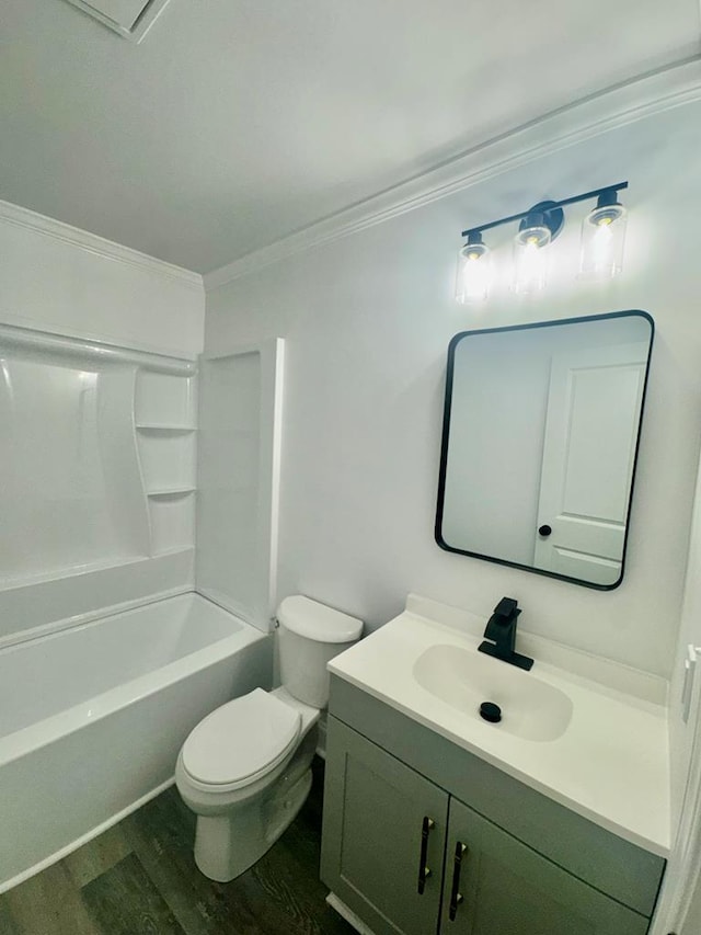 702 N Livingston St, Sylvester, GA 31791 - full bathroom featuring vanity, wood finished floors, crown molding, and bathtub / shower combination