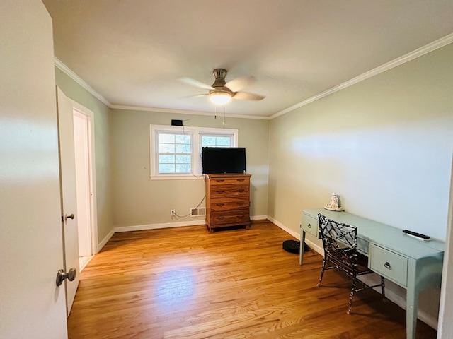 office featuring ceiling fan, crown molding, light wood finished floors, and baseboards