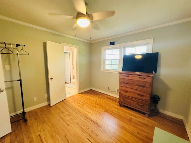 unfurnished bedroom featuring baseboards, ceiling fan, light wood-style floors, and crown molding