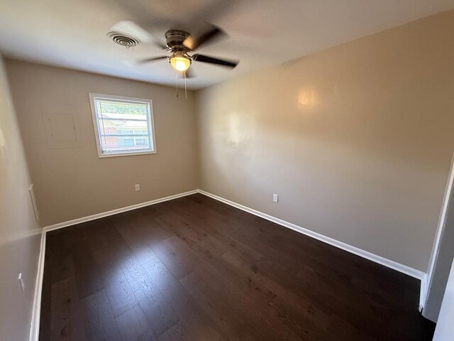 2411 Davis Ave, Tifton, GA 31794 - empty room with ceiling fan and dark wood-type flooring