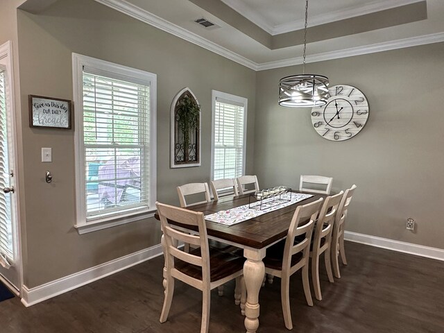 dining space with plenty of natural light, dark wood-style floors, and visible vents