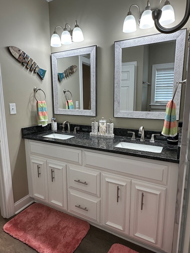 full bath featuring a sink and double vanity