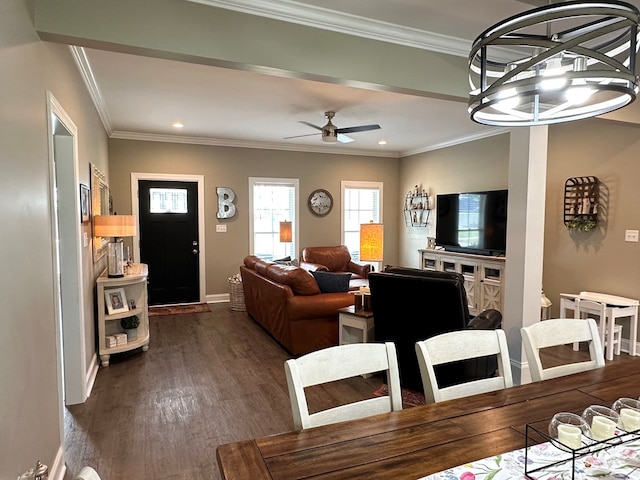 dining space featuring baseboards, recessed lighting, dark wood finished floors, and crown molding