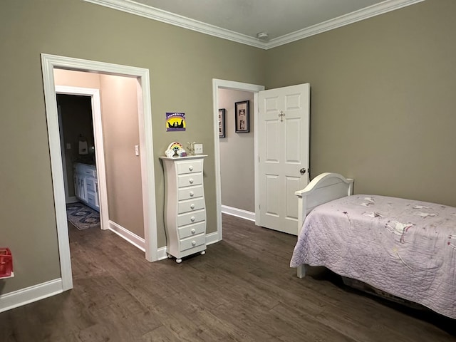 bedroom featuring crown molding, baseboards, and dark wood-style floors