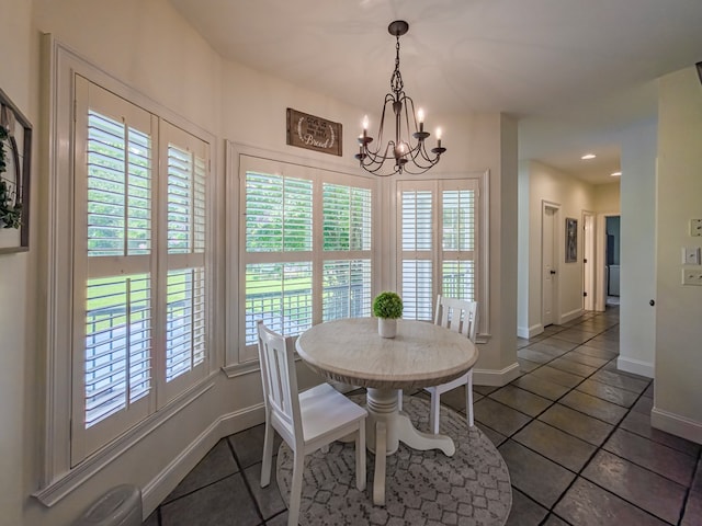 114 Creole Ct, Fitzgerald, GA 31750 - dining space featuring dark tile patterned flooring, a chandelier, and recessed lighting