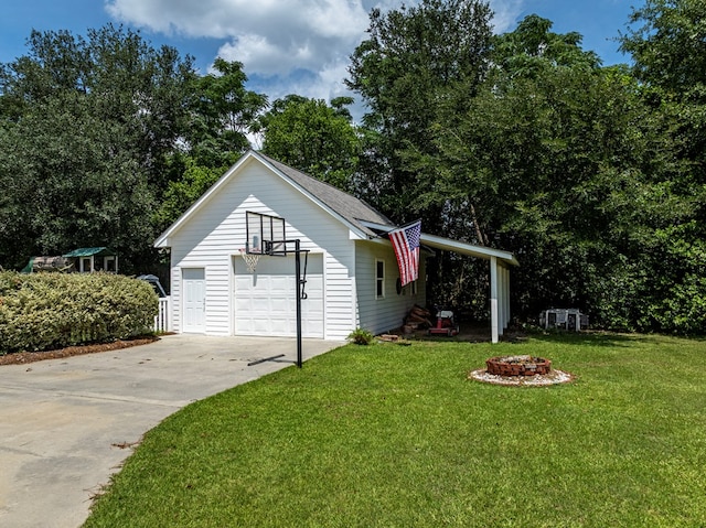 114 Creole Ct, Fitzgerald, GA 31750 - view of outdoor structure with driveway and a fire pit