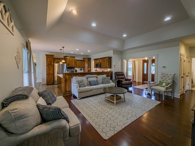 114 Creole Ct, Fitzgerald, GA 31750 - living room featuring a raised ceiling, dark wood-style floors, and recessed lighting