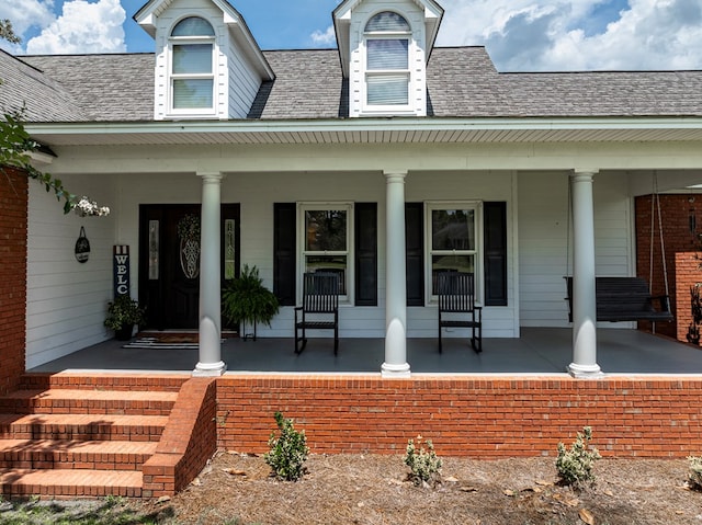 114 Creole Ct, Fitzgerald, GA 31750 - doorway to property featuring covered porch and roof with shingles