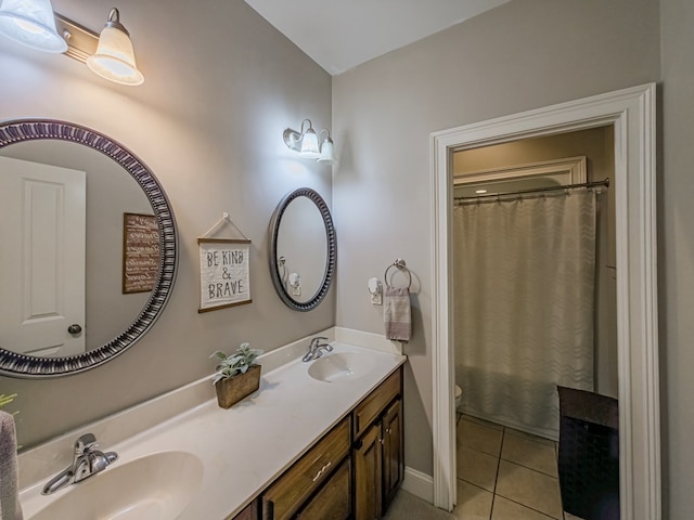 114 Creole Ct, Fitzgerald, GA 31750 - bathroom featuring tile patterned floors, double vanity, and a shower with shower curtain