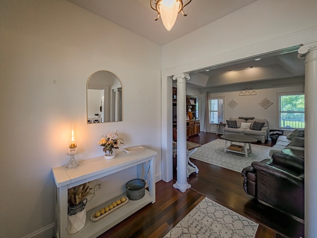 114 Creole Ct, Fitzgerald, GA 31750 - hallway featuring ornate columns, dark wood-style floors, and a tray ceiling