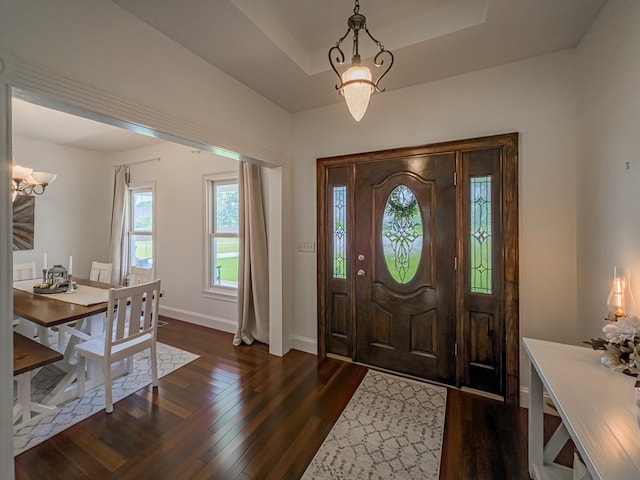 114 Creole Ct, Fitzgerald, GA 31750 - entryway with dark wood-style floors, a chandelier, and a raised ceiling