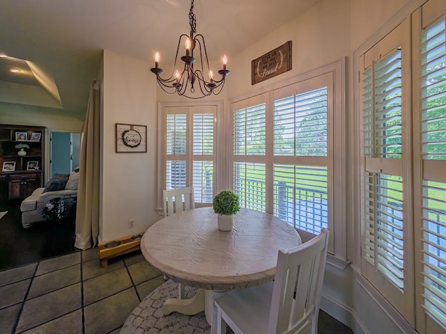 114 Creole Ct, Fitzgerald, GA 31750 - tiled dining room with a chandelier and healthy amount of natural light