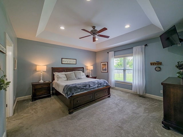 114 Creole Ct, Fitzgerald, GA 31750 - bedroom with a tray ceiling, carpet, recessed lighting, and a ceiling fan