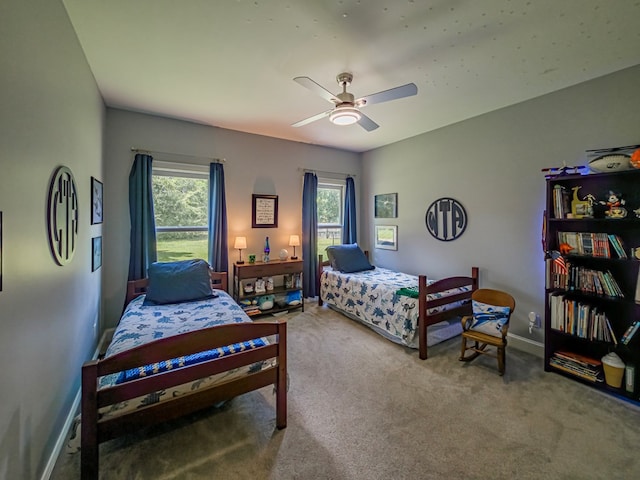 114 Creole Ct, Fitzgerald, GA 31750 - carpeted bedroom with multiple windows and ceiling fan