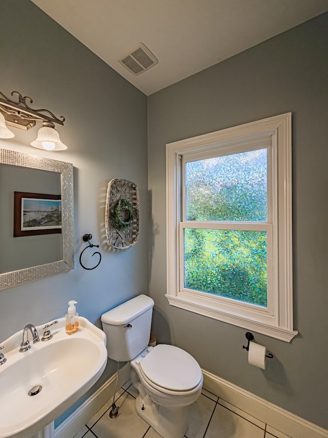 114 Creole Ct, Fitzgerald, GA 31750 - half bathroom featuring tile patterned flooring and toilet