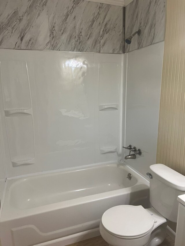 full bath with toilet, vanity, and shower / tub combination