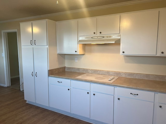 kitchen with white cabinets, under cabinet range hood, white electric stovetop, and dark wood finished floors