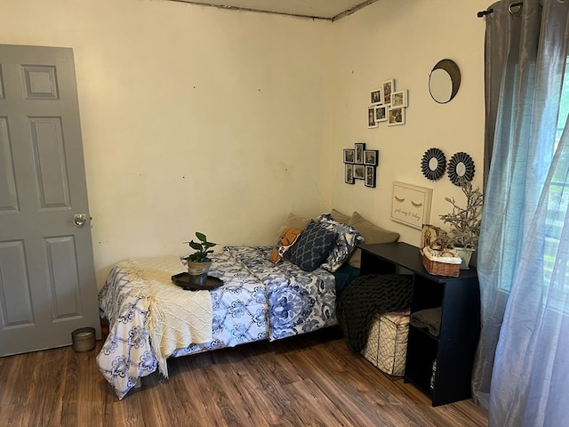 bedroom with wood finished floors