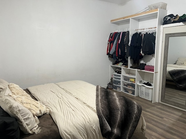 bedroom featuring a closet and wood finished floors