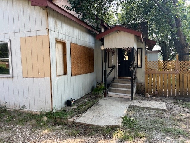 exterior space with entry steps and fence