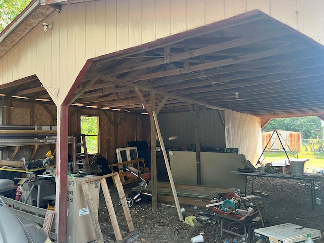view of parking / parking lot with an exterior structure