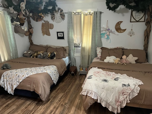 bedroom with wood finished floors
