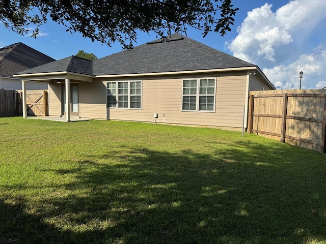 564 Osprey Cir, Tifton, GA 31794 - rear view of house featuring a fenced backyard and roof with shingles