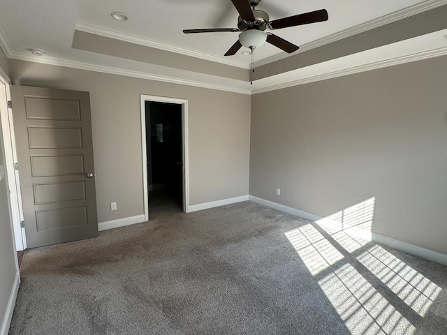 564 Osprey Cir, Tifton, GA 31794 - unfurnished bedroom with carpet floors, a tray ceiling, crown molding, and a ceiling fan