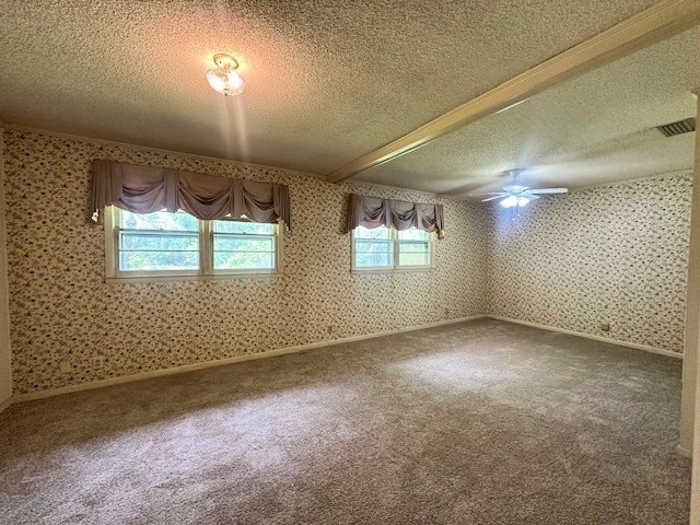 237 Dewey Mcglamry Rd, Fitzgerald, GA 31750 - carpeted spare room with a textured ceiling, wallpapered walls, and a ceiling fan