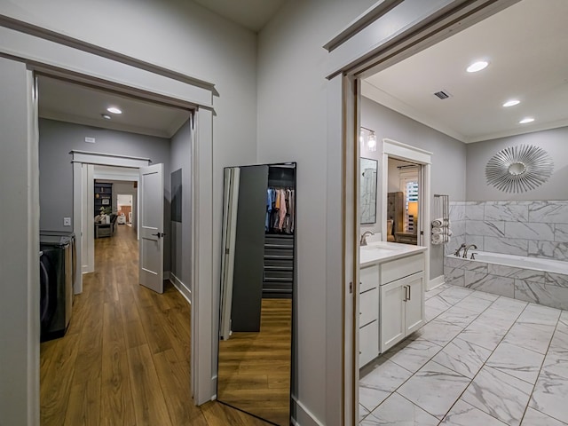113 N Pointe Dr, Fitzgerald, GA 31750 - corridor featuring a sink, baseboards, recessed lighting, and crown molding