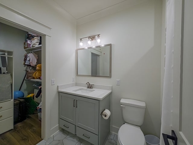 113 N Pointe Dr, Fitzgerald, GA 31750 - full bathroom with toilet, vanity, and baseboards