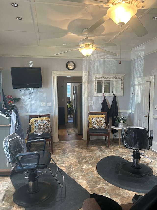 202 N Westberry St, Sylvester, GA 31791 - living area featuring stone finish flooring, wainscoting, crown molding, and a ceiling fan
